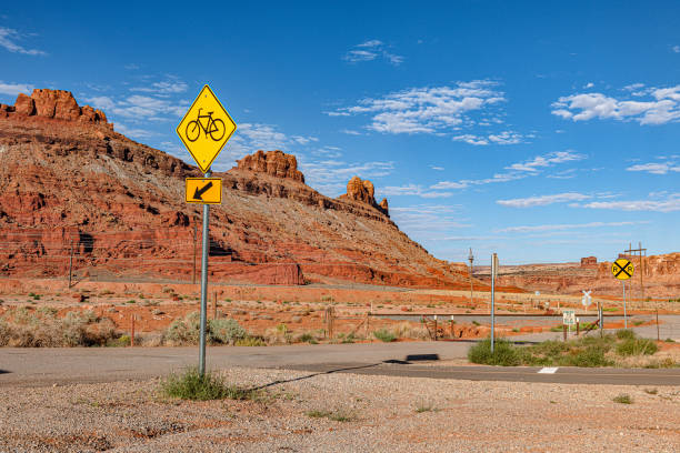 Clear blue sky over Arches Road at Utah National Park, USA Clear blue sky over Arches Road at Utah National Park, USA,Nikon D3x single yellow line sunlight usa utah stock pictures, royalty-free photos & images