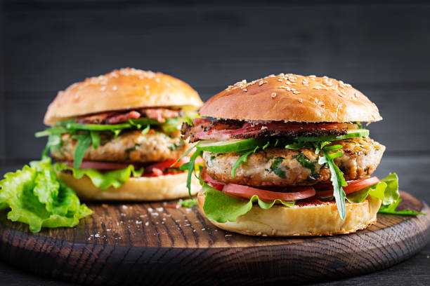 istock Big sandwich - hamburger burger with turkey meat,  tomato,  bacon and lettuce. 1249574332