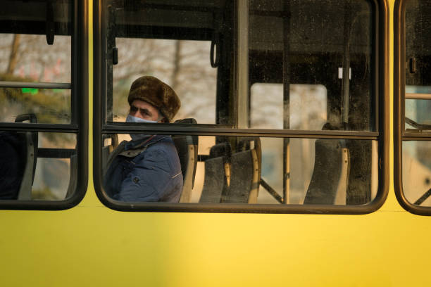 Fear of Coronavirus among elderly citizens are much more than other age groups. Here an old man riding a bus and strictly caring about the social distancing.