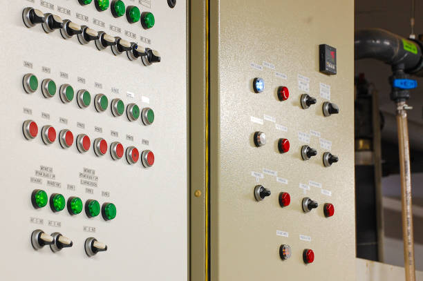 istock Switches on an industrial control board. Lamp indicator and switch of power control panel. 1249577568