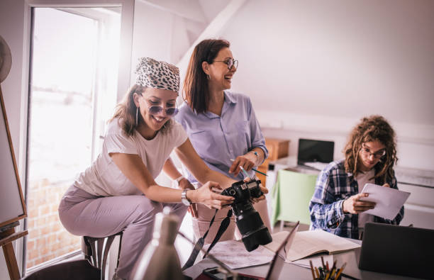istock Team of young designers  cooperating in the office 1249577946