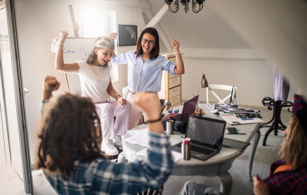istock Team of young designers  cooperating in the office 1249579093