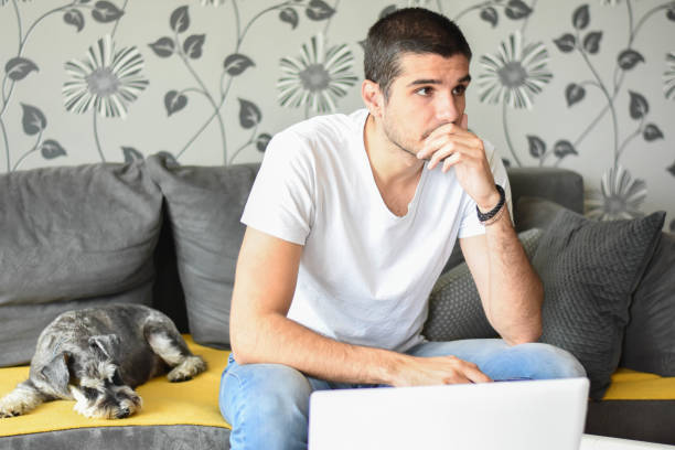 istock Young worried man working from home 1249579236
