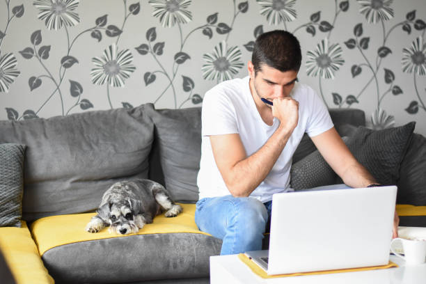 istock Young worried man working from home 1249579374