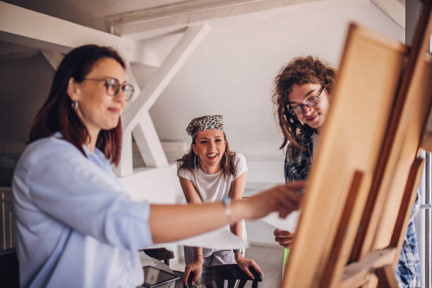 istock Team of young designers  cooperating in the office 1249579446