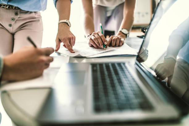 istock Team of young designers  cooperating in the office 1249579450
