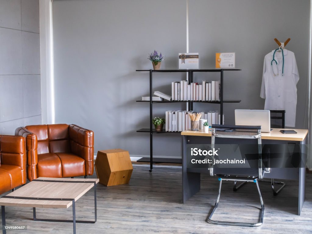 Doctor workplace in office. Modern interior of doctor's office of gynecologist in a clinic. Clean and light interior of medical office. Doctor Stock Photo
