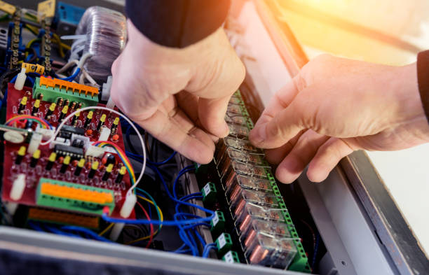 istock The man is repairing the switchboard voltage with automatic switches. 1249582726