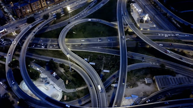 Aerial view of high-level highway interchange at dusk
