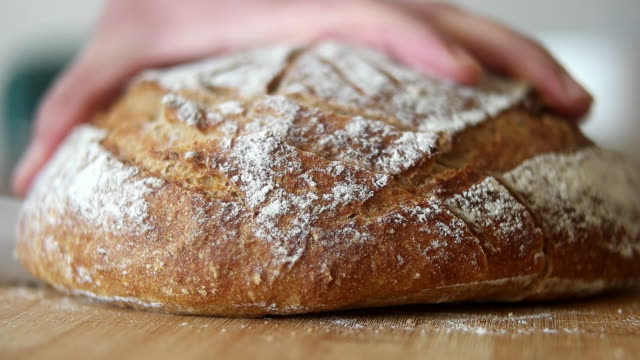 Fresh bread loaf cut into slices