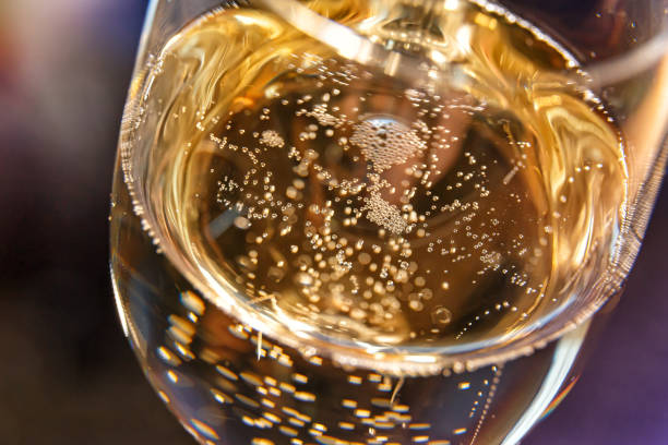 Champagne bubbles in a glass close-up. stock photo