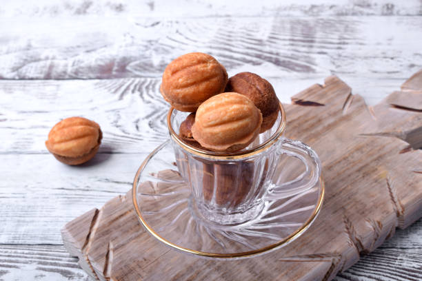 istock Walnut shaped cookies with caramel in a glass cup 1249586484