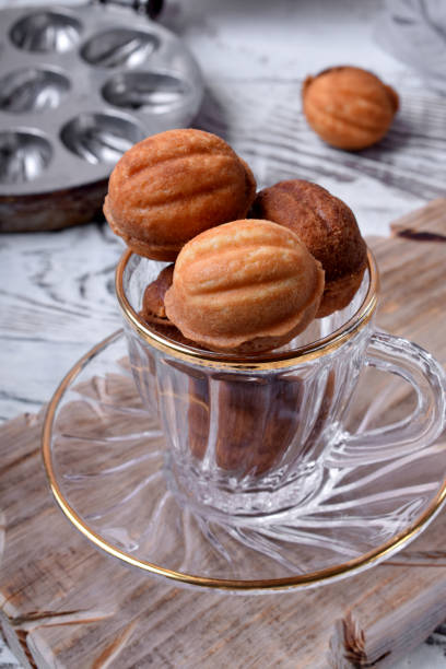 istock Walnut shaped cookies with caramel in a glass cup 1249586486