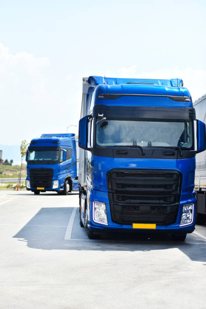 istock Trucks leaving parking lot 1249587837