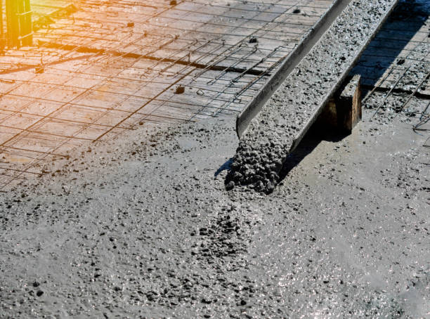 istock Pouring cement during sidewalk upgrade 1249590682