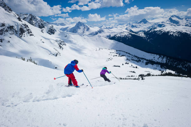 istock Couple skiing in the mountains 1249591249
