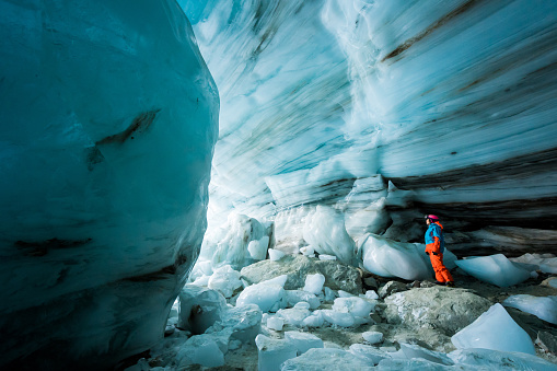 Women exploring an ice cave. Wonders of nature. Immersed in natures beauty.