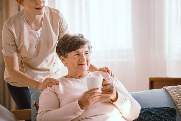 istock Drinking tea in living room 1249592854