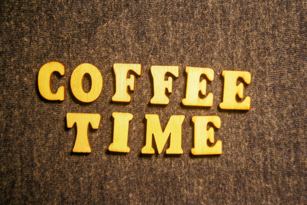 istock Wooden inscription COFFEE TIME on dark background. 1249594136