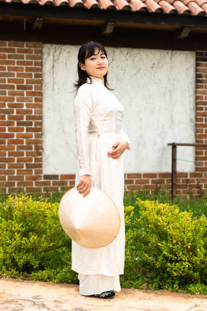 istock Woman wearing ao dai 1249594471