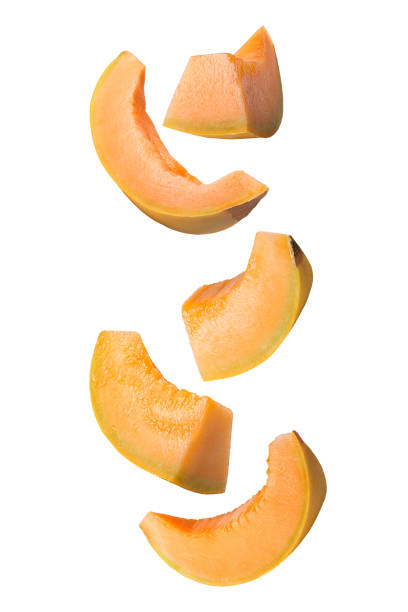istock Flowing melon fruit isolated on white background with shallow depth of field 1249594665