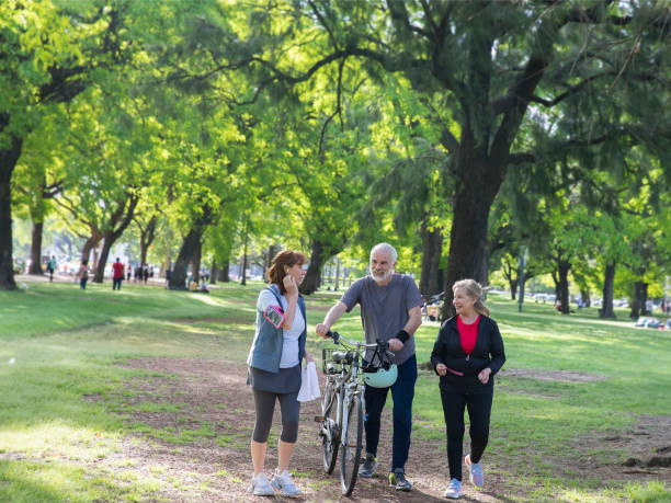 istock Active senior adults exercising in the park 1249595817
