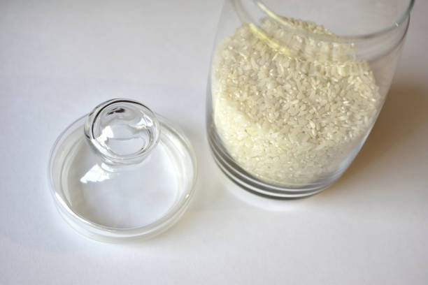 istock Glass vessel with a lid and white rice inside 1249596238