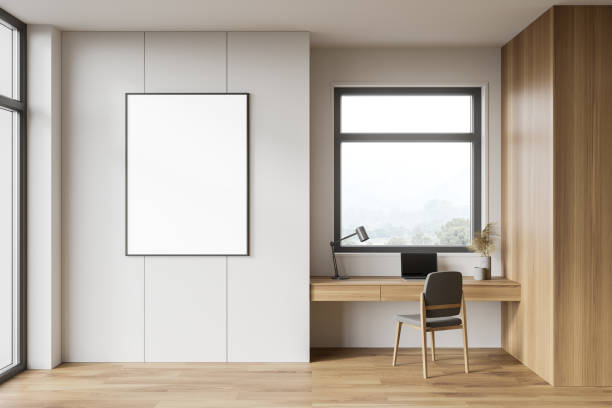 istock White and wooden home office interior with poster 1249596788
