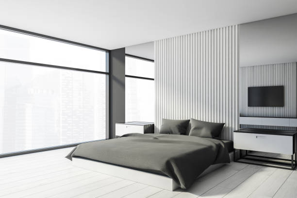 istock White and gray master bedroom with TV 1249598060