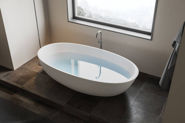 istock Beige and tiled bathroom with tub, top view 1249598625