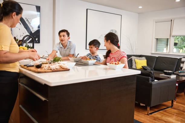 istock Family Cooking At Home 1249599870