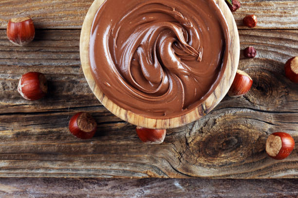 istock Homemade hazelnut spread in a bowl. Hazelnut Nougat cream closeup 1249601313