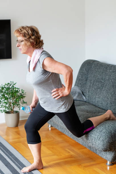 istock Senior woman exercise at home 1249602965