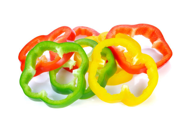 istock Sliced red yellow green pepper isolated on white 1249604405