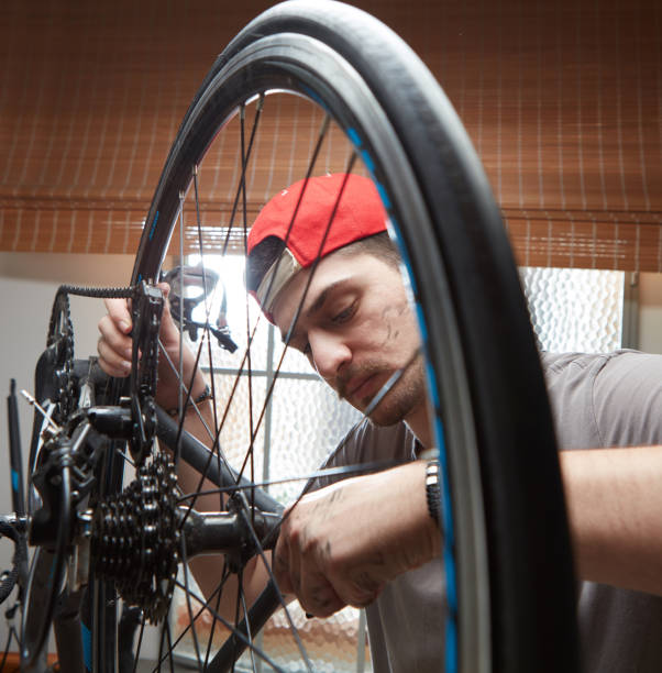 istock Man working on his bike. 1249606466