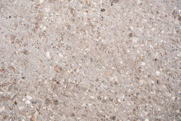 istock texture of concrete floor with small stones 1249607782