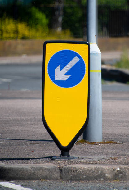 istock A keep left road sign on a yellow reflective stand 1249607811
