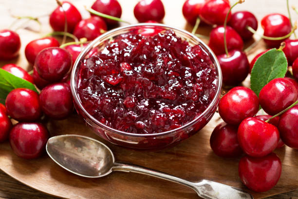 istock bowl of cherry jam and fresh fruits 1249607965