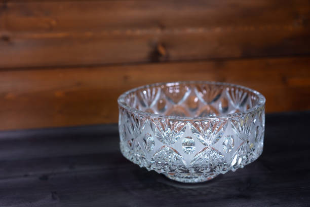 istock Crystal bowl on wooden background 1249609978