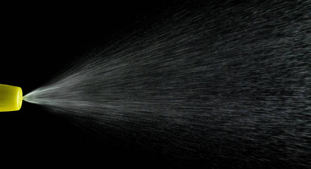 istock Water mist splash bottle isolated on black background. Spray liquid aerosol for perfume. 1249610844