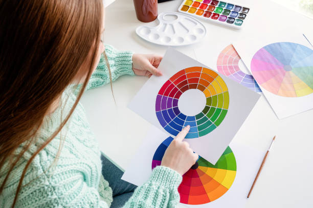 istock Designer or artist working with color samples and color wheel high angle view 1249611824