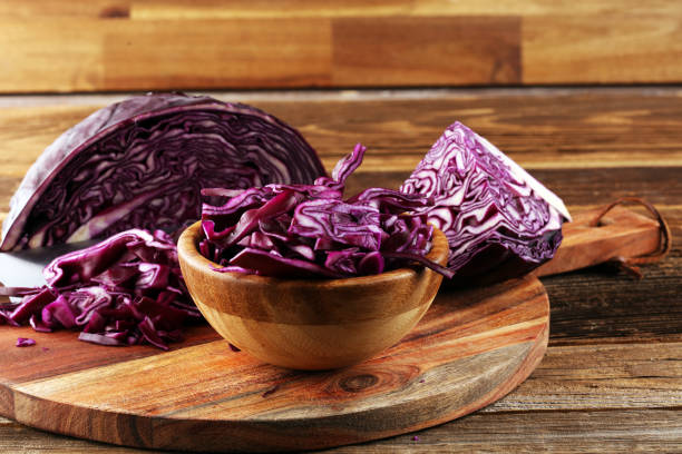 istock Chopped fresh red cabbage. Prepare sliced vegetable for cooking purple cabbage salad or coleslaw. Homemade food concept. 1249612863