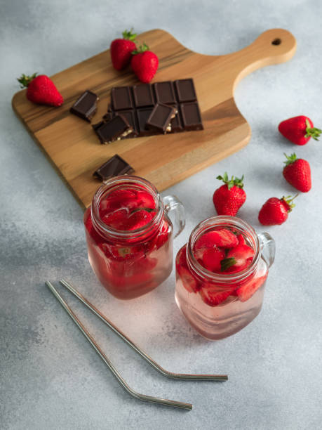 istock Strawberry drinks with berries and wooden board with dark chocolate 1249614093