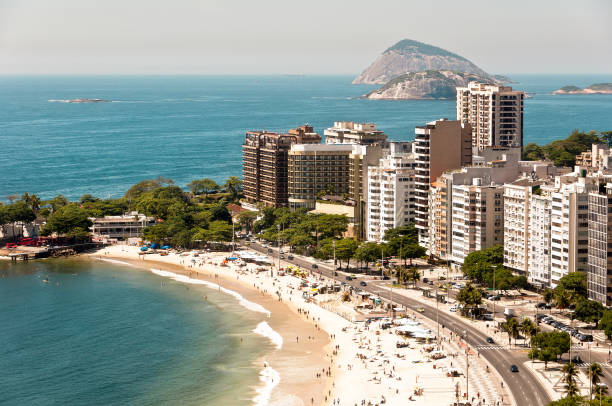 View of Residential and Apartment Buildings in Front of the Copacabana Beach Expensive apartment and hotel buildings in front of the Copacabana beach and Atlantic ocean with islands in the horizon, in Rio de Janeiro, Brazil. copacabana stock pictures, royalty-free photos & images