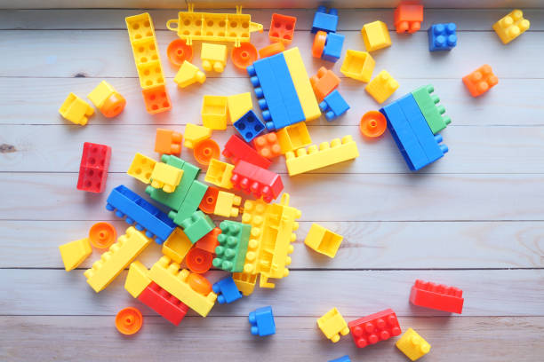 istock colorful building blocks on wooden table , top view 1249614554