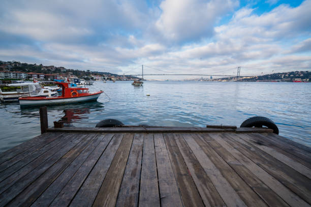 istock Boats and pier with dramatic sky 1249616711