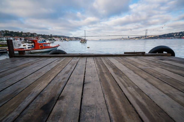 istock Boats and pier with dramatic sky 1249617431