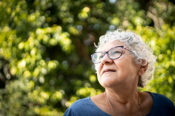 istock Senior woman looking away and thinking 1249617845