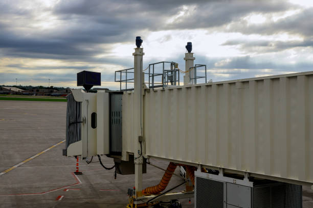 Waiting in airport in airplane for bridge passengers boarding jetway