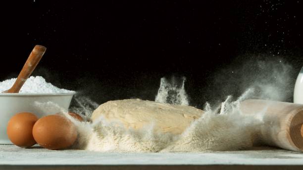 istock Freeze motion of falling yeast dough into flour 1249620591